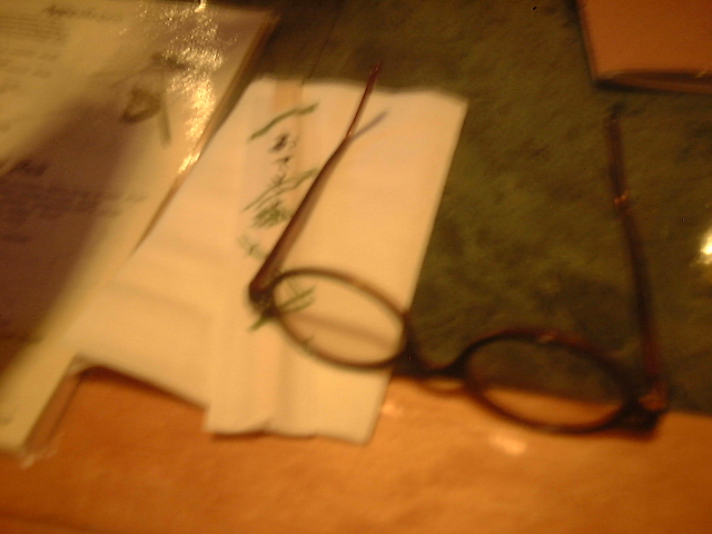 glasses with chopsticks and menu